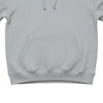 Close-up view of a women’s basketball hoodie, focusing on the chest logo icon, hood, and upper front panel.