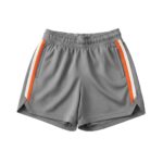 Front view of women’s basketball shorts laid flat, featuring a relaxed ladies’ fit, elastic waistband with drawcord, mid-thigh length, and a small logo icon near the hem.