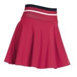 Front view of women’s high performance tennis skort on a model, featuring a flat waistband, smooth front panel, and built‑in shorts designed for coverage and easy movement on court.