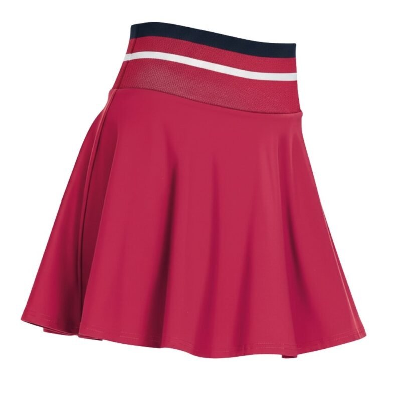 Front view of women’s high performance tennis skort on a model, featuring a flat waistband, smooth front panel, and built‑in shorts designed for coverage and easy movement on court.