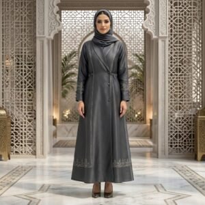 Front view of woman wearing a black abaya with 3D geometric background