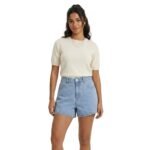 Front view of a model wearing baggy jeans shorts.