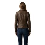 Woman wearing a brown leather biker jacket shown from the back.
