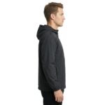 Man wearing a camping jacket, side view on a plain background.