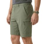 Male model wearing men’s casual shorts side view, showing relaxed fit, leg length, and pocket placement.