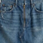 Close-up detail shot of custom trendy denim mini skirt showing fabric quality and stitching, manufactured by Eco Jersey Limited