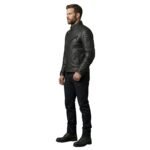 Male model wearing a men’s faux leather biker jacket, side view on a plain background.