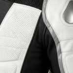 Close-up view of heated motorbike suit material showing fabric texture and construction detail