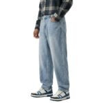 Front-side view of a model wearing hip-hop baggy jeans.