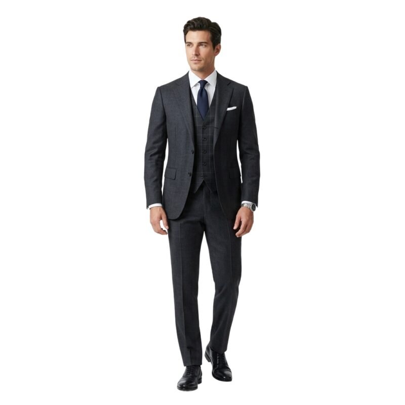 Male model wearing a black three‑piece suit with black tie, front view on a plain background.