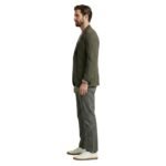 Side view of a model wearing men’s casual pants.