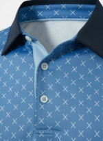 Close‑up view of a men’s printed golf polo shirt collar and upper chest, showing the all‑over pattern, buttons, and smooth wrinkle‑free stretch fabric.