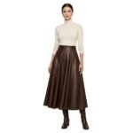 Model wearing brown leather pleated mini skirt