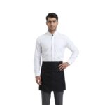 Male server wearing a white shirt, black waist apron, and black trousers, standing in a professional pose.