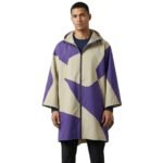 Male model wearing a waterproof rain poncho front view, showing hood, wide coverage, and relaxed fit.
