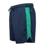 Side view of men’s rugby training shorts in red showing the elastic waistband, relaxed leg opening, and small hem logo icon, displayed on a plain background.