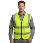 Man wearing custom fluorescent yellow hi-vis safety vest over grey shirt – custom workwear lifestyle photo