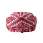 Traditional shemagh kufiya scarf hanging to show full length and pattern.