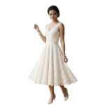 Side view of a model wearing a short wedding dress.
