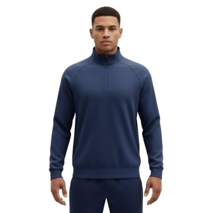 Model wearing a soccer quarter-zip training shirt, standing in a relaxed pose to show the athletic fit, stand collar, and long sleeves