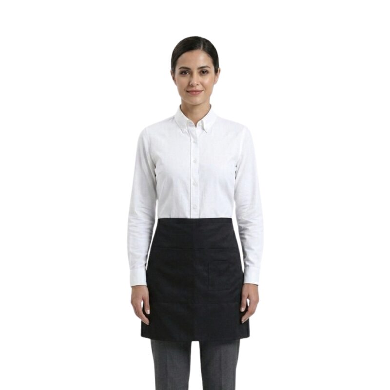 Woman wearing a white shirt, black waist apron, and black trousers in a professional server uniform.