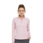 Woman wearing a pink lightweight golf quarter‑zip top on the course, with a stand collar, half zipper, long sleeves, and a small logo icon on the left chest.