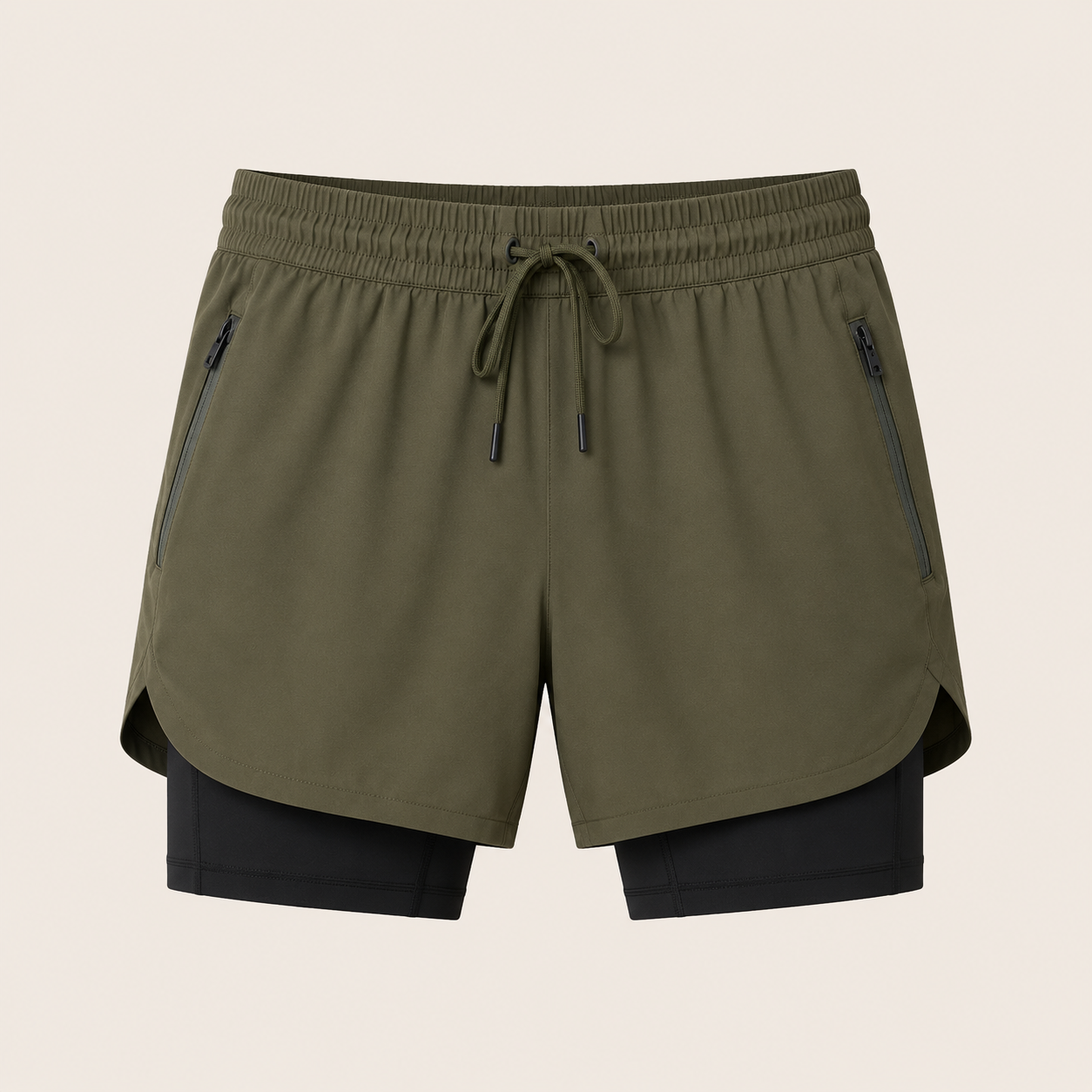 Custom 2-in-1 activewear shorts manufacturer showing men's olive green dual-layer shorts with inner black compression liner and side zip pockets on a beige background