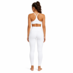 Back view of model wearing compression leggings showing rear panel, waistband, and full length coverage for women's activewear