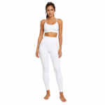 Front view of model wearing compression leggings showing waistband, side pocket placement, and full-length fit for women's activewear