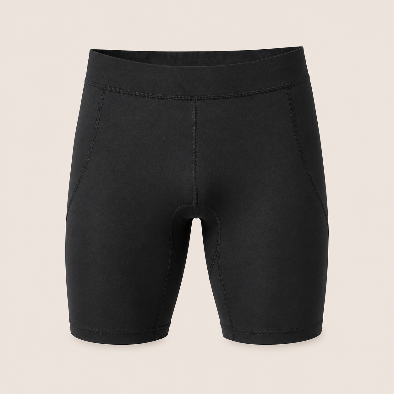 Custom compression shorts manufacturer showing men's tight-fitting black compression shorts with moisture-wicking fabric and flatlock seams on a beige background