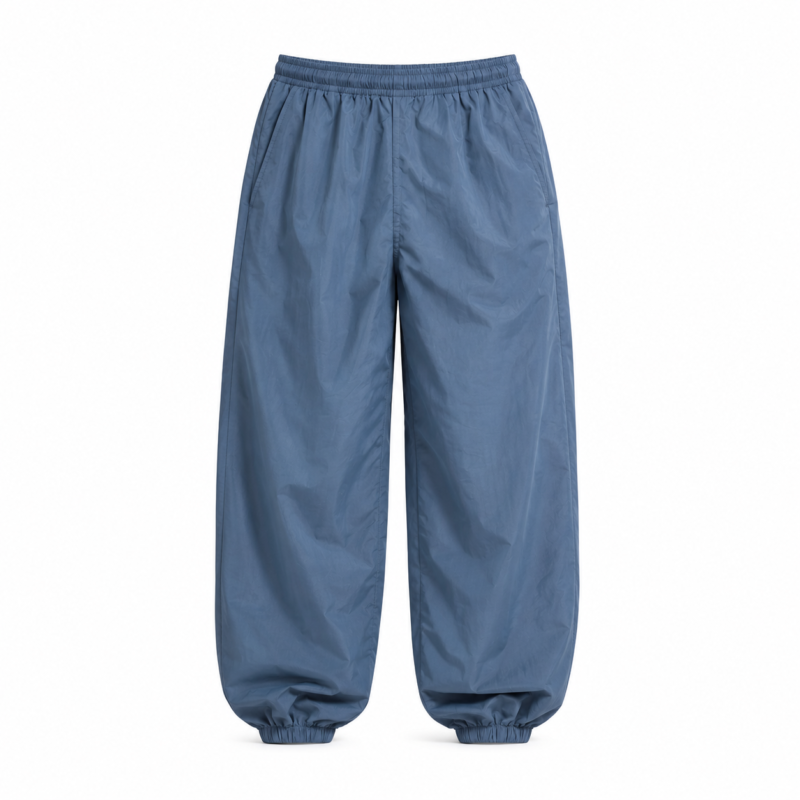 Custom blue pumper pants by Eco Jersey on a ghost mannequin, featuring an elastic waistband, balloon-style baggy leg, and elastic ankle cuffs for a comfortable relaxed streetwear fit