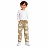 Young boy wearing khaki distressed denim jeans with all-over white daisy floral patch embroidery, white long-sleeve top, and white sneakers on a transparent background