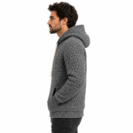 Male model wearing a custom knitted hoodie side view for men's knitwear product page