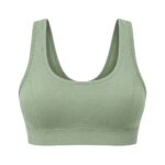 A light sage green sports bra on a white background with a U-shaped neckline and wide shoulder straps.