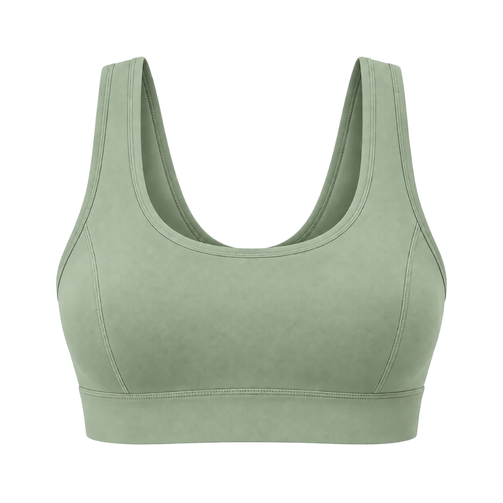 yoga bra A light sage green sports bra on a white background with a U-shaped neckline and wide shoulder straps.