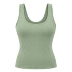 Light sage green athletic tank top with a scoop neckline and thick straps, shown from the front on a plain white background.